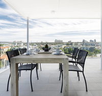 Minimalist Penthouse Condo with Skyline Vistas - Holiday Find